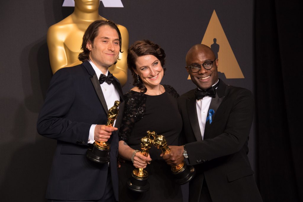 Jeremy Kleiner, Adele Romanski and Barry Jenkins at the 2017 Academy Awards in Los Angeles. 